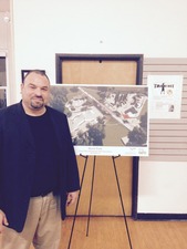 Chris Limon, of Linda Vista, at the State of the Neighborhood Address, in front of an aerial rendering of the Linda Vista Skate Park 