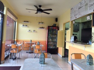 The dining room of Mister Falafel, in Clairemont, is quaint and bright