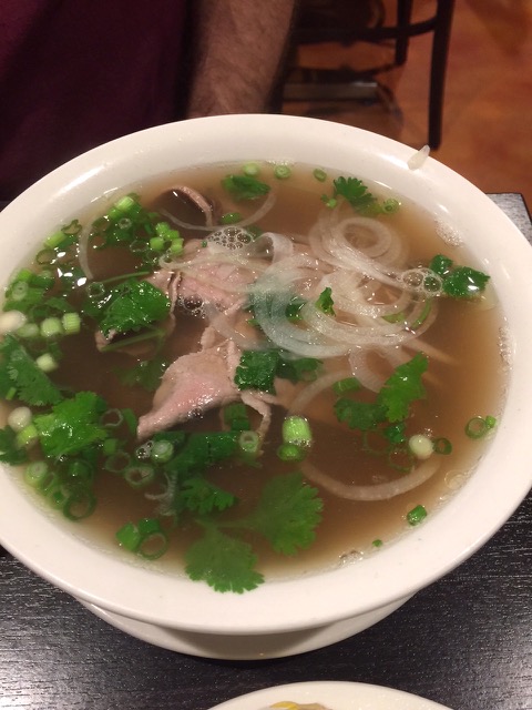 A “small” bowl of rare steak/well done steak pho with onions and cilantro. Photo by Michael Baehr