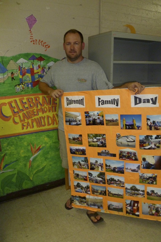 South Clairemont Recreation Council president Chris Pierce with Family Day photos and Clairemont Family Day mural at the South Clairemont Recreation Center 