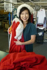 Sarah Na takes Santa's suit for dry cleaning (photo by Bill Swank) 