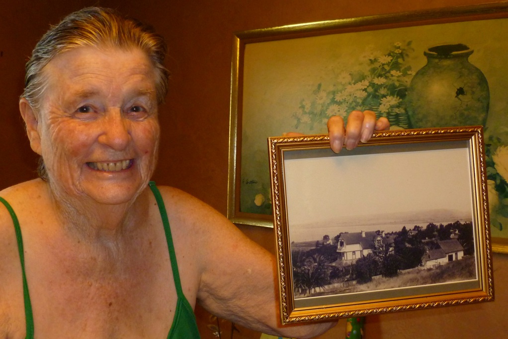 Irene Spencer holds a picture of her childhood home