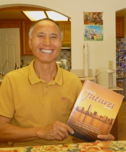 Yam Lee holds Community College brochure